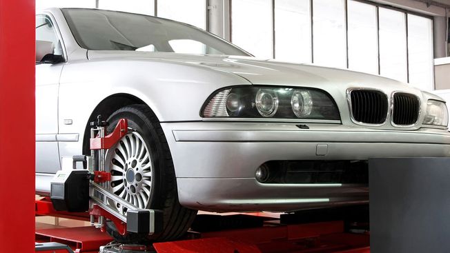 A car on a lift ready for a M.O.T